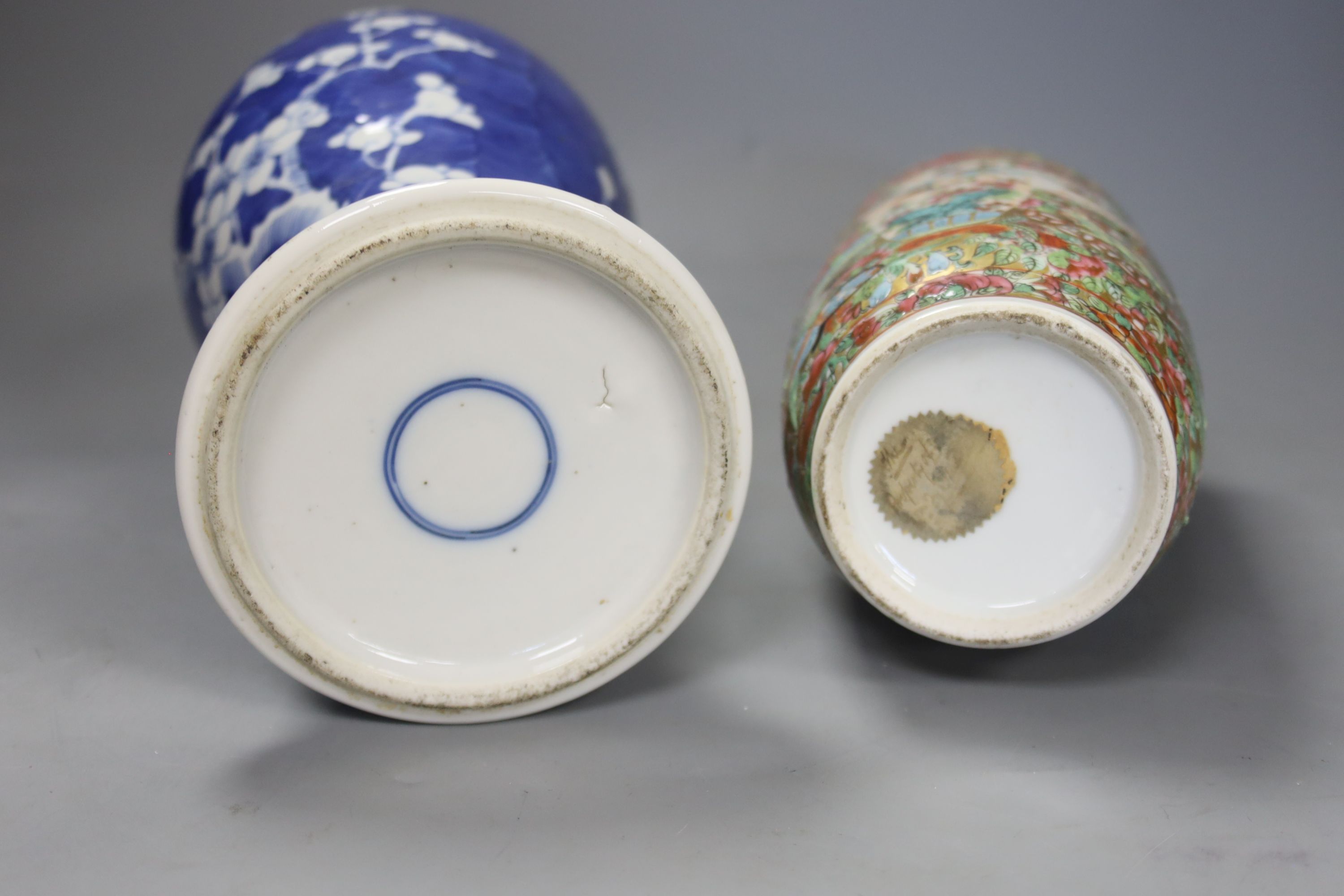 An early 20th century Chinese blue and white ‘prunus’ vase a Republic period millefleur dish, a similar Canton vase and two blue and white jars
